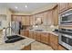 Beautiful kitchen featuring stainless steel appliances, wood cabinets, and granite countertops at 4665 E Dartmouth St, Mesa, AZ 85205