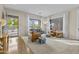 Bright and airy living room with stylish furniture, hardwood, and carpet flooring at 4665 E Dartmouth St, Mesa, AZ 85205