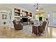 Comfortable living room featuring hardwood floors, built-in shelves, and ample seating at 4665 E Dartmouth St, Mesa, AZ 85205