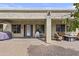 Covered patio area with brick pavers, outdoor seating, and string lights at 4665 E Dartmouth St, Mesa, AZ 85205