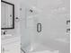 Modern bathroom featuring a sleek, glass-enclosed shower with white marble-style tile at 5747 E Star Valley St, Mesa, AZ 85215