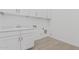 Bright laundry room with white cabinets and modern fixtures at 5747 E Star Valley St, Mesa, AZ 85215