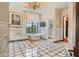 Luxurious bathroom with a freestanding tub under a window and mosaic tile flooring at 5902 E Arcadia Ln, Phoenix, AZ 85018