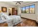 Comfortable bedroom with a large window showcasing mountain views at 5902 E Arcadia Ln, Phoenix, AZ 85018