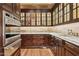 Well-appointed butler's pantry with custom cabinets, stainless steel appliances, and marble countertops at 5902 E Arcadia Ln, Phoenix, AZ 85018
