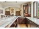 Gourmet kitchen boasts custom cabinetry, marble countertops, and modern appliances at 5902 E Arcadia Ln, Phoenix, AZ 85018