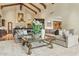Open-concept living room with beamed ceilings is perfect for entertaining and relaxation at 5902 E Arcadia Ln, Phoenix, AZ 85018