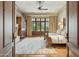 Spacious main bedroom with French doors, detailed ceilings, fireplace, and elegant decor at 5902 E Arcadia Ln, Phoenix, AZ 85018