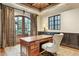 Sophisticated home office with hardwood floors, French doors, statement rug, elegant lighting, and refined window at 5902 E Arcadia Ln, Phoenix, AZ 85018