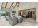 Inviting outdoor space with stone walls, comfortable seating, and a fireplace at 5902 E Arcadia Ln, Phoenix, AZ 85018