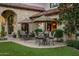Enjoy outdoor dining on the beautiful patio with comfortable seating and shaded umbrellas at 5902 E Arcadia Ln, Phoenix, AZ 85018