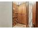 Cozy wine cellar with custom wood shelving and storage, perfect for wine enthusiasts at 5902 E Arcadia Ln, Phoenix, AZ 85018