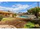 Landscaped backyard featuring a pool and patio for relaxing and enjoying the outdoor space at 5939 W Cheery Lynn Rd, Phoenix, AZ 85033