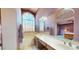This primary bathroom features dual sinks, a soaking tub, and ample natural light at 6720 W Mcrae Way, Glendale, AZ 85308
