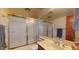 This bathroom features a bathtub with shower, tile flooring, and a vanity at 6720 W Mcrae Way, Glendale, AZ 85308