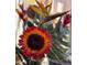 Close-up of a vibrant sunflower floral arrangement, adding charm and color to the interior at 6720 W Mcrae Way, Glendale, AZ 85308