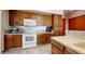Kitchen features stainless steel appliances, stone countertops and wood cabinetry at 6720 W Mcrae Way, Glendale, AZ 85308