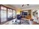 This well-lit living room provides a view of the pool, tile flooring, and backyard access at 6720 W Mcrae Way, Glendale, AZ 85308