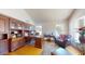 Bright home office with wooden built-ins, large desk and comfortable chair at 6720 W Mcrae Way, Glendale, AZ 85308