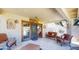 Covered patio with comfortable seating, a ceiling fan, and access to a pool area, perfect for outdoor relaxation at 6720 W Mcrae Way, Glendale, AZ 85308