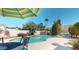 Beautiful backyard pool area surrounded by mature trees and plenty of space for outdoor entertaining at 6720 W Mcrae Way, Glendale, AZ 85308