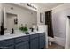 Bathroom features modern fixtures, double sinks, and a shower-tub combo at 7120 W Columbine Dr, Peoria, AZ 85381