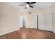 A simplistic bedroom with sliding closet doors and plenty of space for a bed and other furniture at 7120 W Columbine Dr, Peoria, AZ 85381