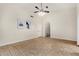 Bright living room with neutral walls, tile flooring, and modern wall art on display at 7120 W Columbine Dr, Peoria, AZ 85381