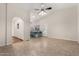 Expansive living area showcasing hardwood floors, kitchen access, and great natural light at 7120 W Columbine Dr, Peoria, AZ 85381