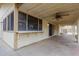 Covered patio area with ceiling fan and view of yard at 7120 W Columbine Dr, Peoria, AZ 85381