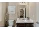 Cozy bathroom featuring a vanity with decorative touches and a framed inspirational art piece at 7726 E Baseline Rd # 156, Mesa, AZ 85209