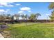 Community dog park featuring green space and mature trees at 7726 E Baseline Rd # 156, Mesa, AZ 85209