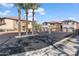 Gated entrance to a community with palm trees at 7726 E Baseline Rd # 156, Mesa, AZ 85209