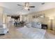 Open concept living room and kitchen featuring pendant lights and dining area at 7726 E Baseline Rd # 156, Mesa, AZ 85209