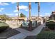 Community pool area with landscaping and comfortable seating arrangements at 7726 E Baseline Rd # 156, Mesa, AZ 85209