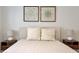 Well lit bedroom featuring a comfortable bed, neutral colors and bedside lighting at 7908 W Harmony Ln, Peoria, AZ 85382