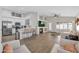 Cozy living area with an open concept to the kitchen, fireplace, and bar stool seating at 7908 W Harmony Ln, Peoria, AZ 85382