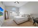 Bright main bedroom features vaulted ceilings, neutral decor, and ample natural light at 7908 W Harmony Ln, Peoria, AZ 85382