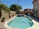 Inviting backyard pool and spa surrounded by desert landscaping and a private patio area at 7908 W Harmony Ln, Peoria, AZ 85382