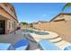 Beautiful backyard with pool, spa, lounge chairs, and covered patio, perfect for outdoor enjoyment at 7908 W Harmony Ln, Peoria, AZ 85382