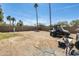 Expansive backyard with desert landscaping, block fence, and sunny skies at 8218 S 7Th St # 163, Phoenix, AZ 85042