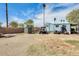 Spacious backyard featuring a utility vehicle, shed, and open area perfect for outdoor activities and storage at 8218 S 7Th St # 163, Phoenix, AZ 85042