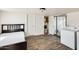 Bedroom featuring ensuite access to both a bathroom and a laundry room at 8218 S 7Th St # 163, Phoenix, AZ 85042