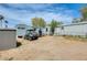 Exterior view of the property showing multiple mobile homes, a shed, and an off-road vehicle at 8218 S 7Th St # 163, Phoenix, AZ 85042