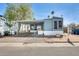 Charming single-level home with covered parking and a well-kept front yard under a bright blue sky at 8218 S 7Th St # 163, Phoenix, AZ 85042