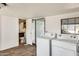Bright and airy laundry room featuring a washer and dryer with backyard access at 8218 S 7Th St # 163, Phoenix, AZ 85042
