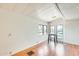 Bright living room with wood floors, many windows, and white walls at 8218 S 7Th St # 163, Phoenix, AZ 85042