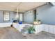 A covered patio area with steps, potted plants, and an inviting entryway to the home at 8218 S 7Th St # 163, Phoenix, AZ 85042