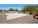 Backyard features a private basketball court, desert landscaping, and neutral toned walls, perfect for outdoor fun at 8406 E Calle Buena Vis, Scottsdale, AZ 85255