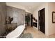 Elegant bathroom with standalone tub, a fireplace, and an ornate vanity at 8406 E Calle Buena Vis, Scottsdale, AZ 85255